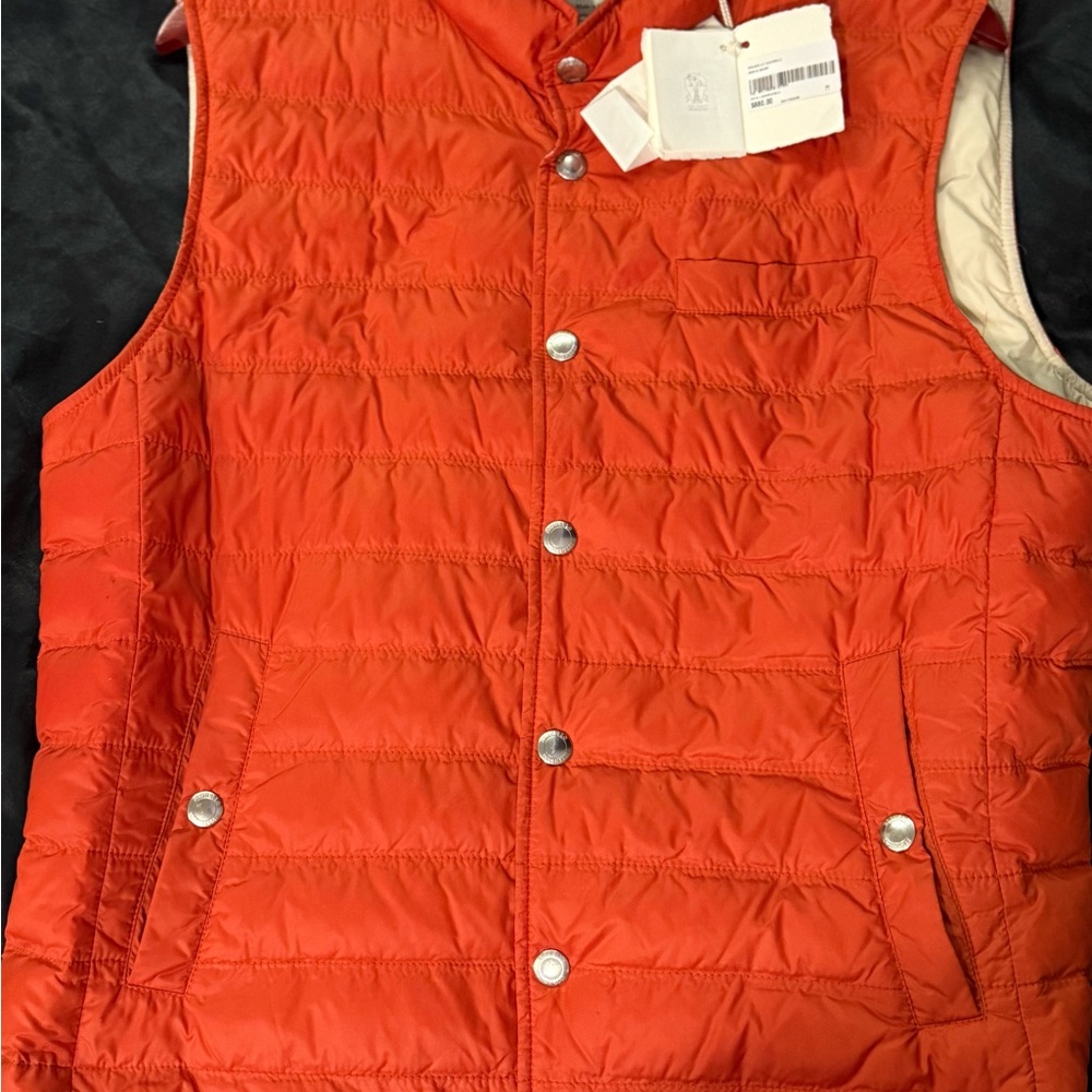 Orange Quilted Vest with Snap Buttons. Never been worn, still has its tags.